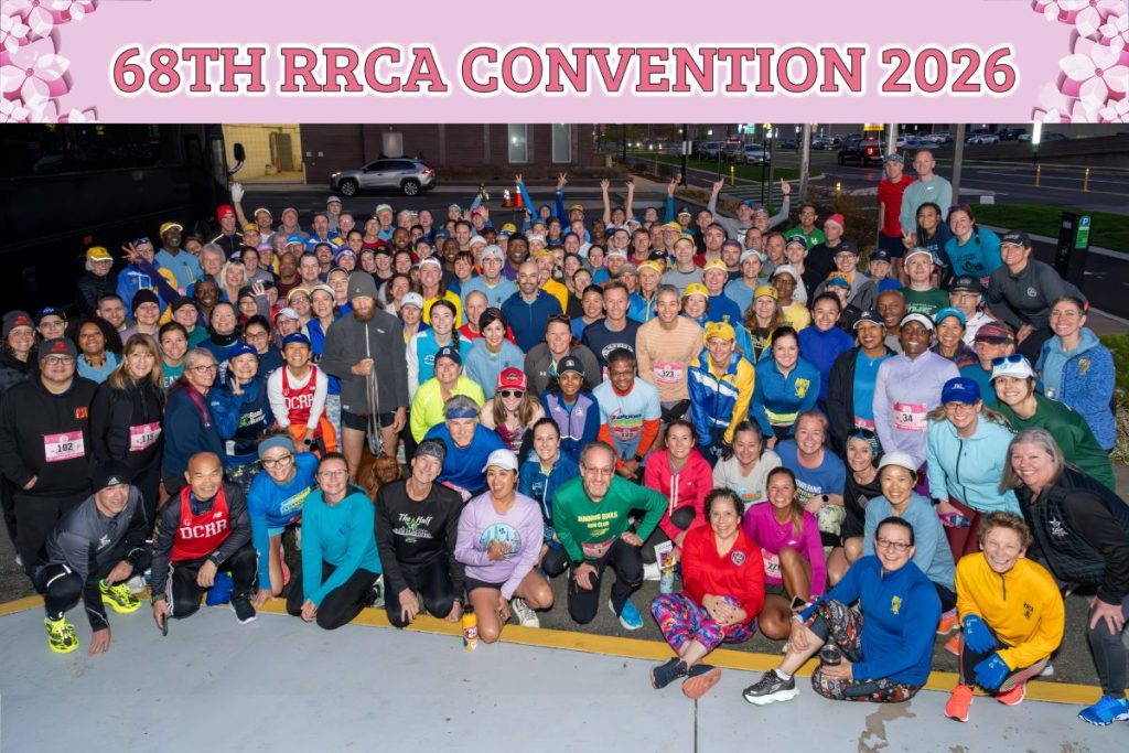 a large group of runners in colorful clothing kneeling and standing for a group photo prior to the RRCA morning group run led by DC Road runners
